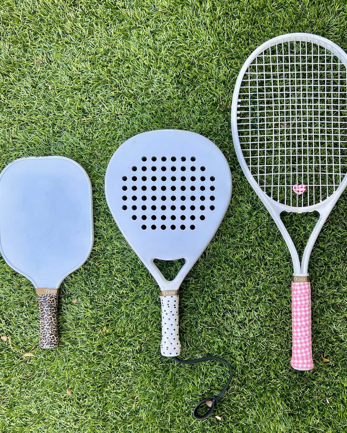 TESSI overgrip and dampener styled on a racket