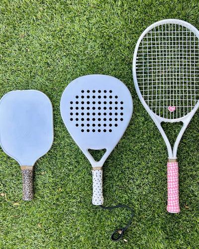TESSI overgrip and dampener styled on a racket