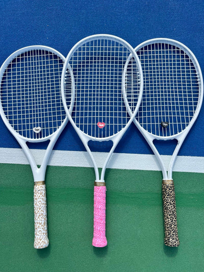 Animal Lover overgrips wrapped on three rackets