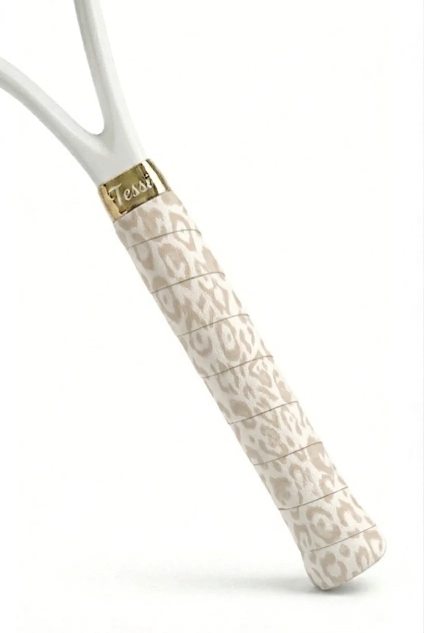 TESSI cream vine pattern overgrip wrapped on a white racket